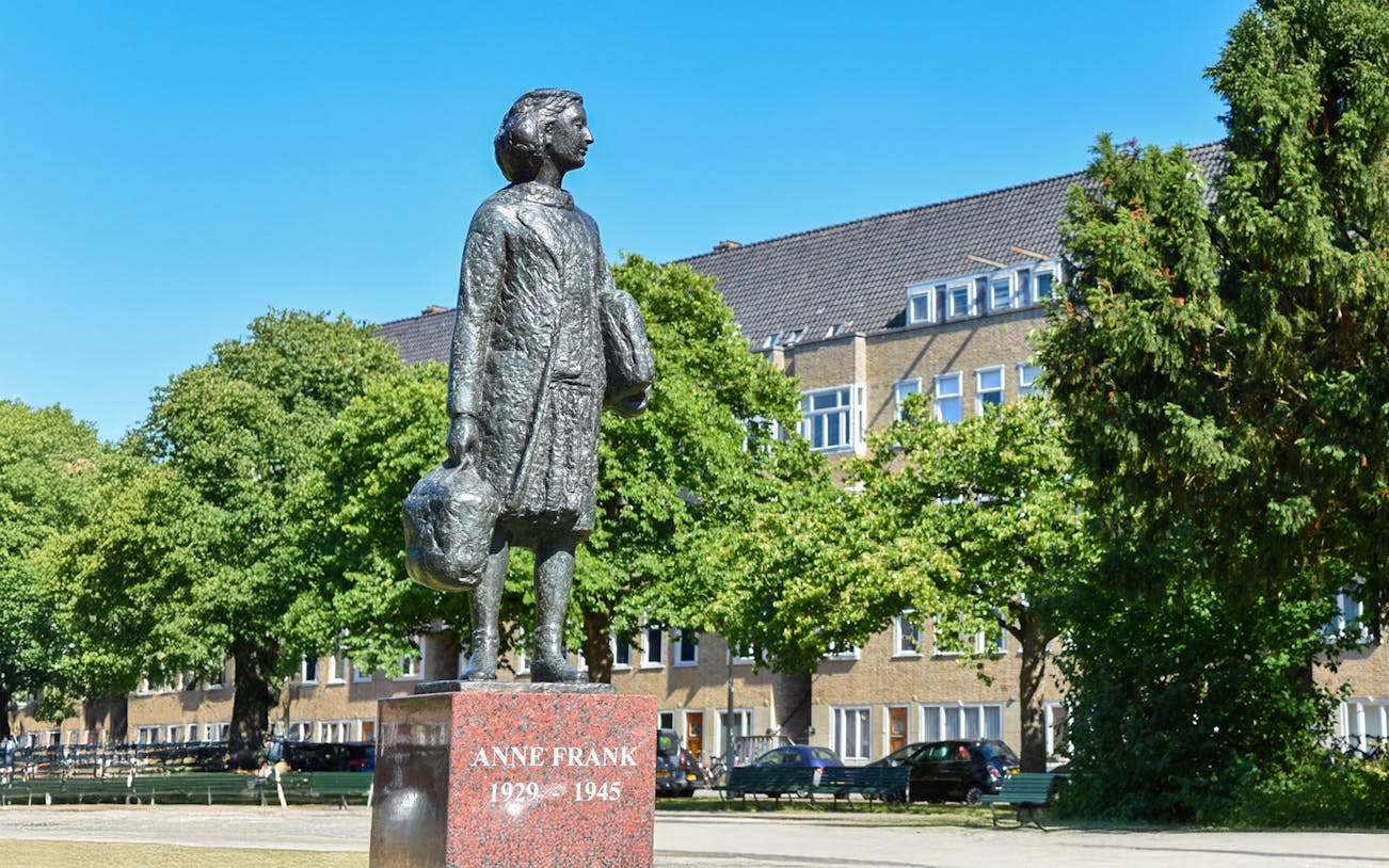 Anne Frank statue in Amsterdam neighborhood on walking tour.