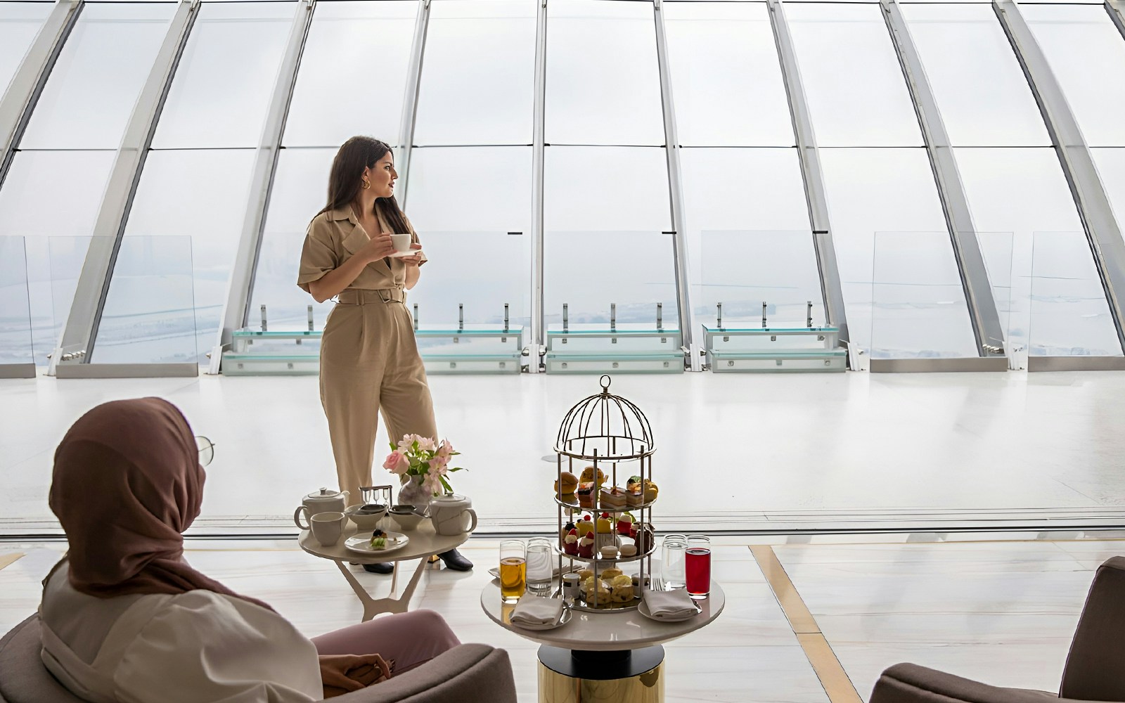 High tea setup with pastries and drinks at The View at The Palm, Dubai.