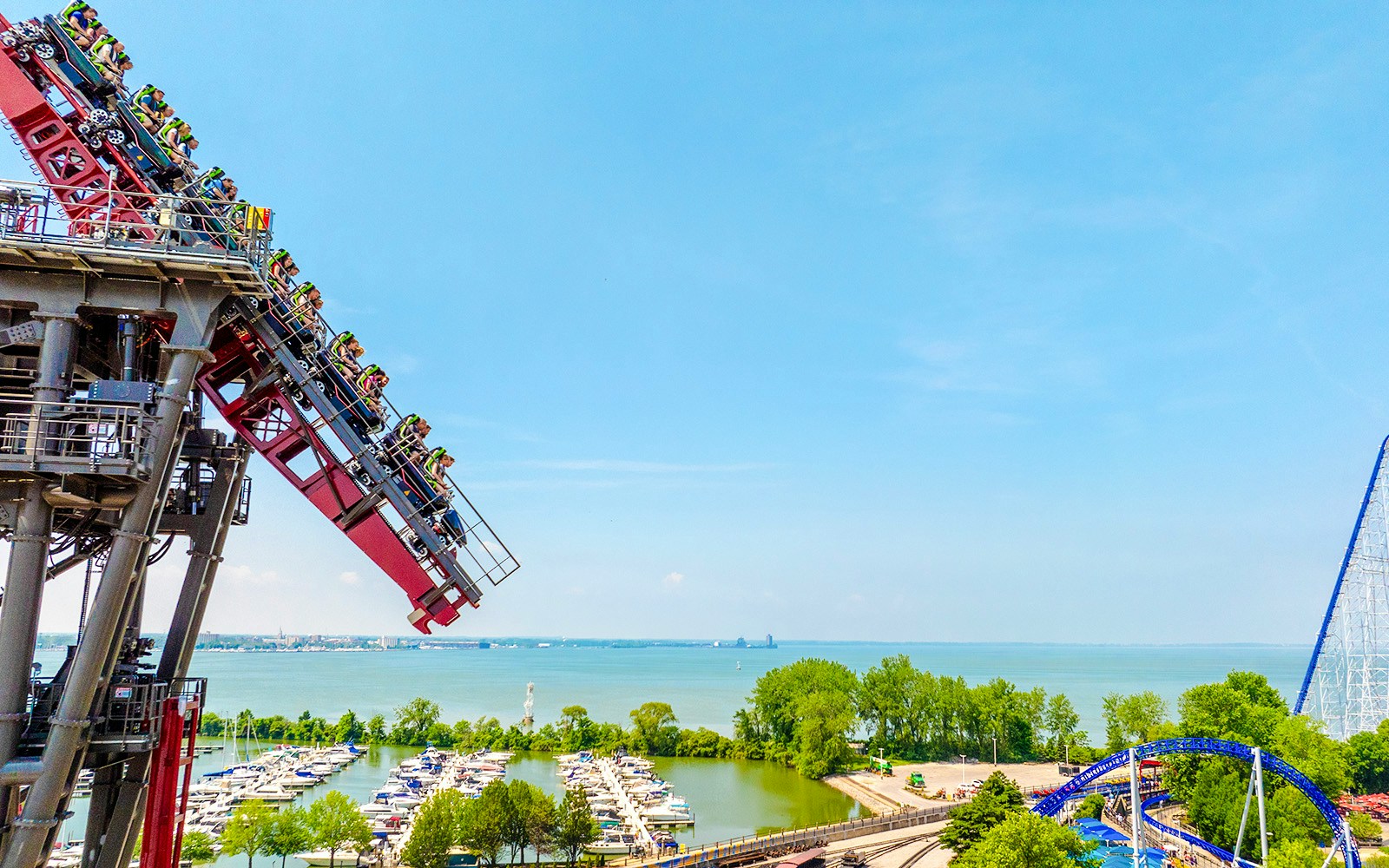 Roller coaster descending at Cedar Point with Lake Erie in the background.