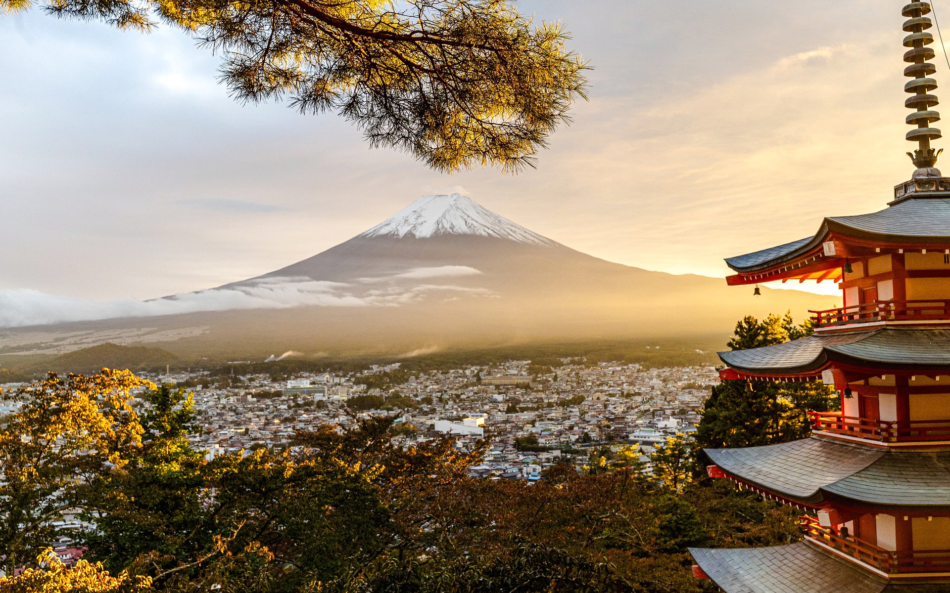 Pagoda overlooking Mount Fuji at sunrise in Japan.