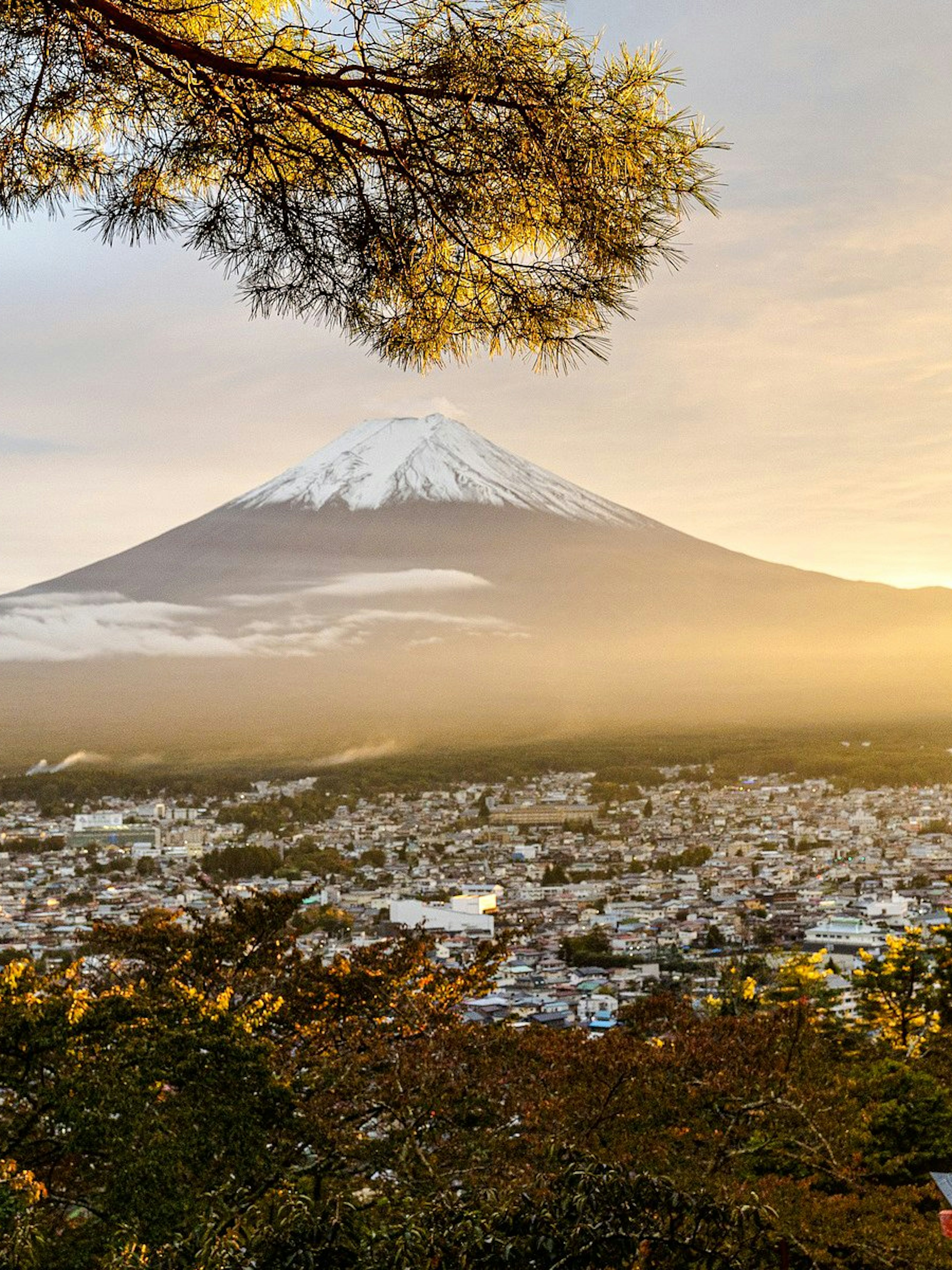 Pagoda overlooking Mount Fuji at sunrise in Japan.