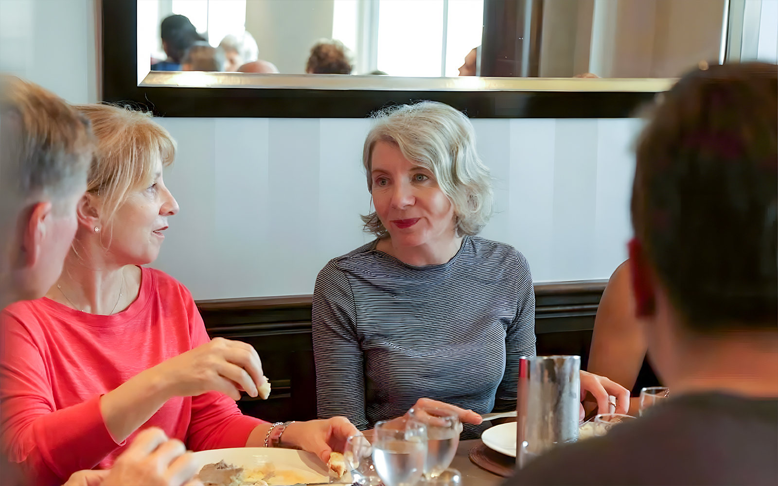 Group dining during D-Day Normandy Beaches tour from Paris.