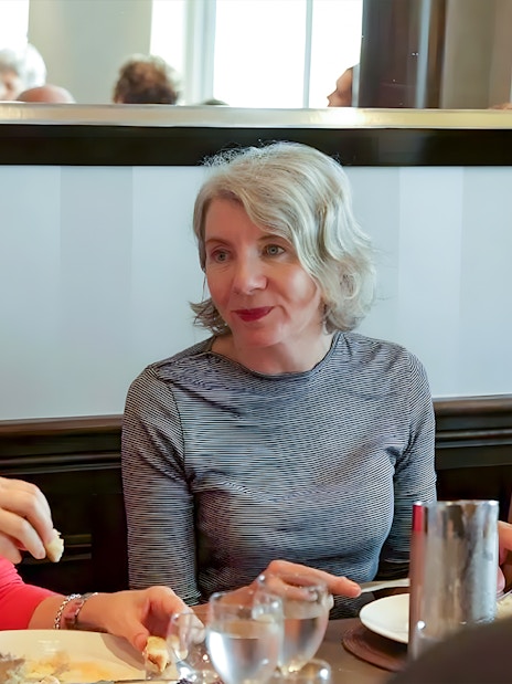 Group dining during D-Day Normandy Beaches tour from Paris.