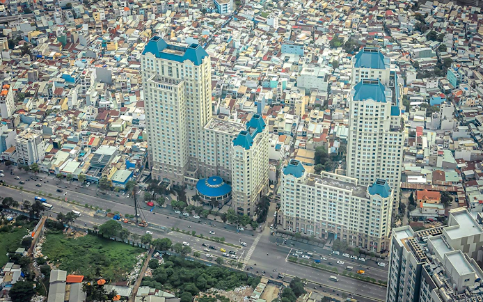 Aerial view of Saigon cityscape from Landmark 81, featuring high-rise buildings and busy streets.