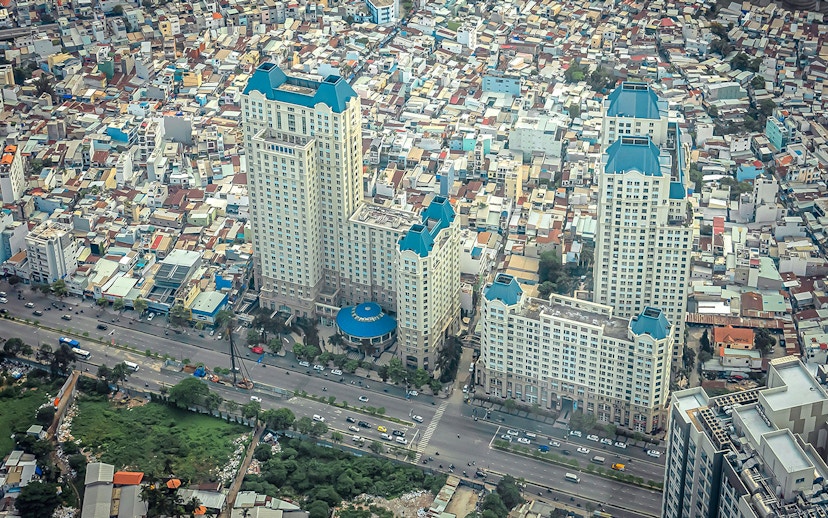 Aerial view of Saigon cityscape from Landmark 81, featuring high-rise buildings and busy streets.