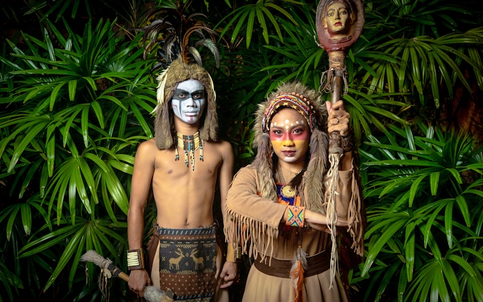 Performers in traditional costumes at Sunway Lagoon night park.