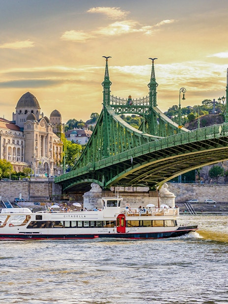Sightseeing cruise on the Danube River near Liberty Bridge, Budapest.