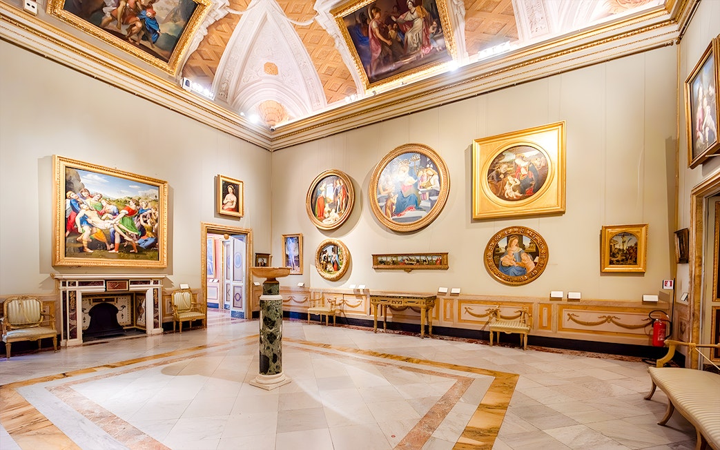Borghese Gallery interior with classical paintings and ornate ceiling.