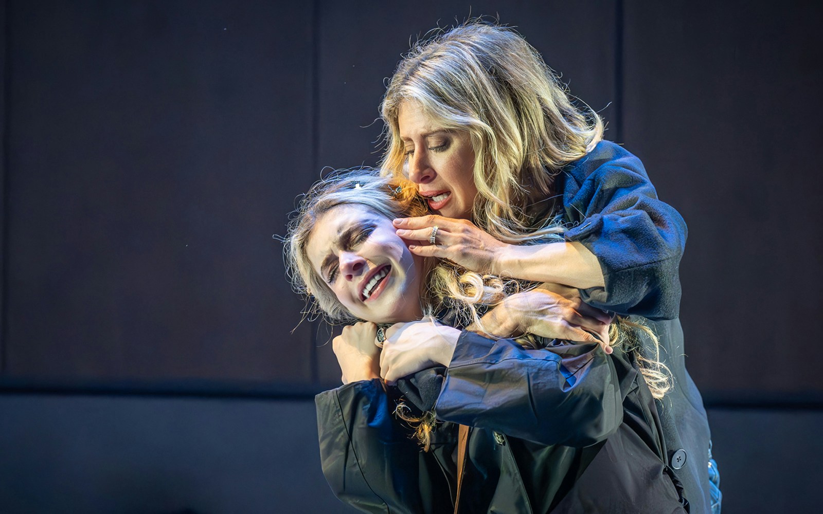Actors performing an emotional scene in the musical "Next to Normal.