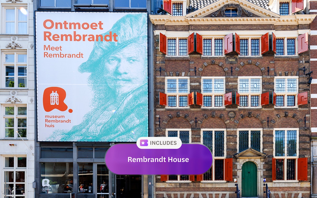 Rembrandt House Museum exterior with red shutters and promotional banner in Amsterdam.