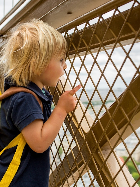 Child viewing Paris from Eiffel Tower Summit.