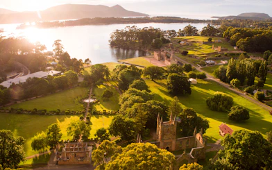 Aerial view of Port Arthur Historic Site and lush landscape on the Tasman Peninsula, Tasmania.
