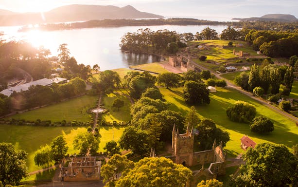 Aerial view of Port Arthur Historic Site and lush landscape on the Tasman Peninsula, Tasmania.