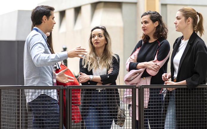 Tour guide explaining to a group during the Invalides & Napoleon's Tomb tour in Paris.