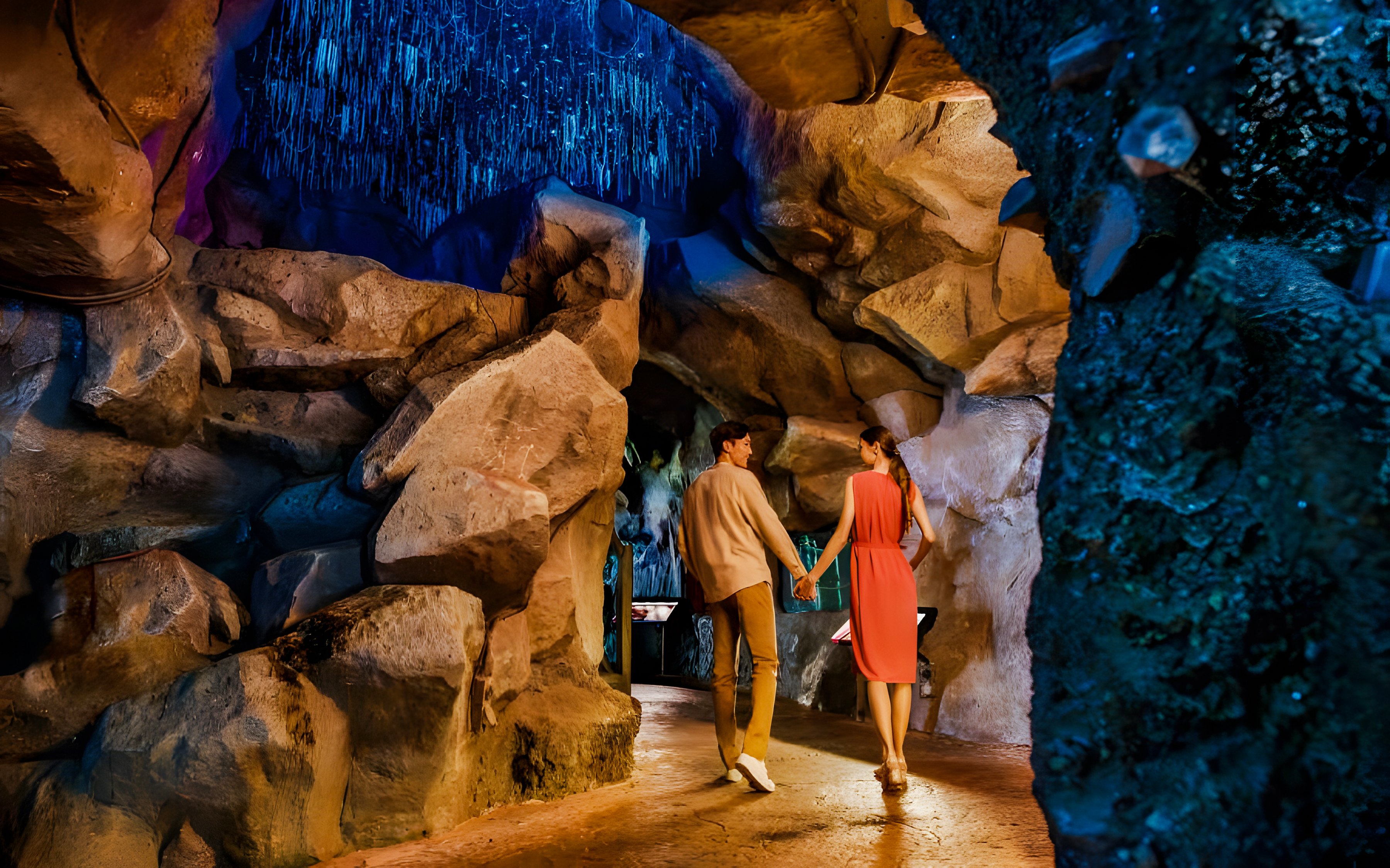 Couple exploring cave at Night Safari, Mandai Wildlife Reserve.