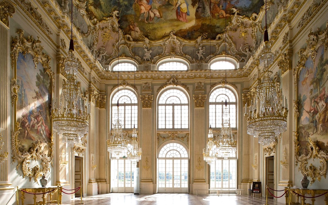Munich Residenz ornate hall with chandeliers and frescoed ceiling, part of city pass tour.