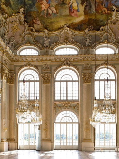 Munich Residenz ornate hall with chandeliers and frescoed ceiling, part of city pass tour.