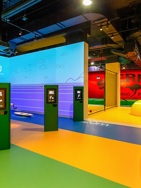 Interactive sports exhibits at Melbourne Cricket Ground tour.