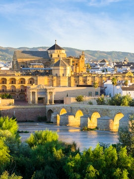 Cathedral and Roman bridge over the Guadalquivir River in Córdoba, Spain.