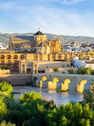 Cathedral and Roman bridge over the Guadalquivir River in Córdoba, Spain.