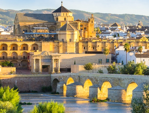 Cathedral and Roman bridge over the Guadalquivir River in Córdoba, Spain.