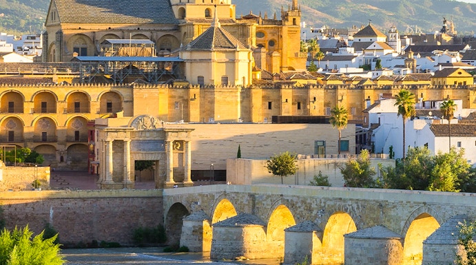 Cathedral and Roman bridge over the Guadalquivir River in Córdoba, Spain.