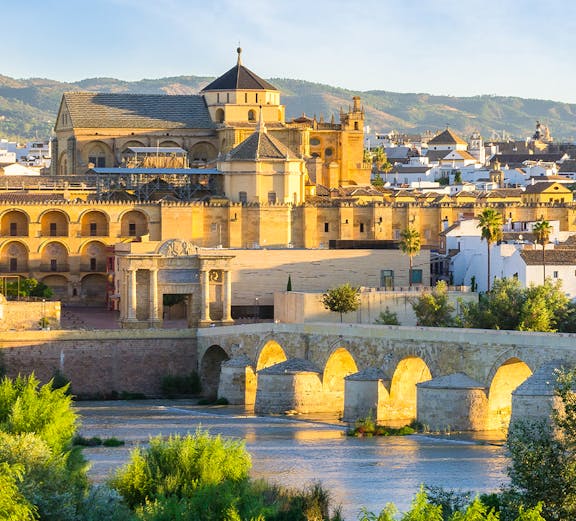 Cathedral and Roman bridge over the Guadalquivir River in Córdoba, Spain.