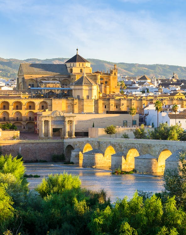 Cathedral and Roman bridge over the Guadalquivir River in Córdoba, Spain.