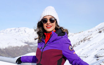 Person enjoying snowy mountain view on Valle Nevado tour, Santiago.