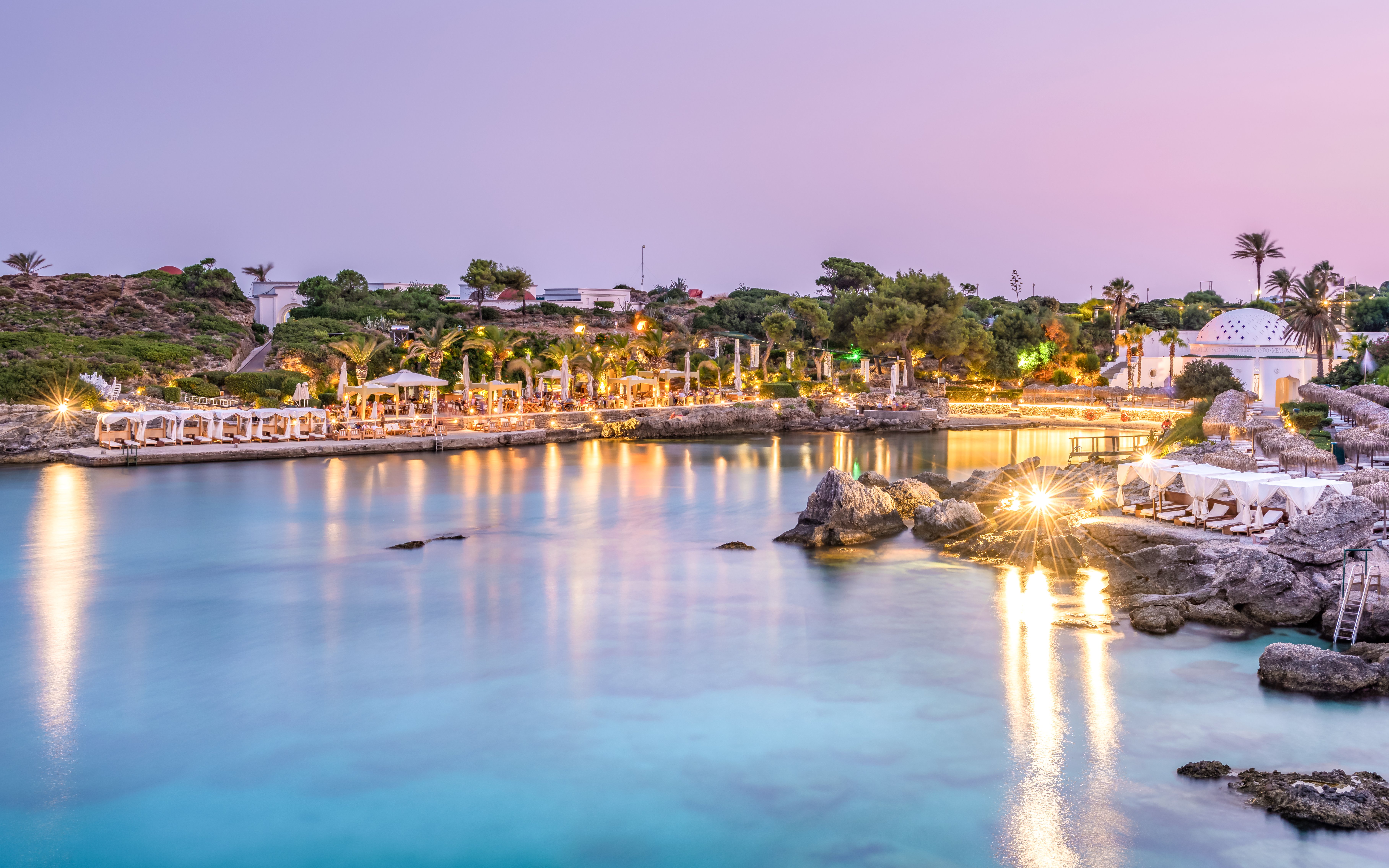 Kallithea Springs illuminated at dusk with reflections on the water, Rhodes, Greece.