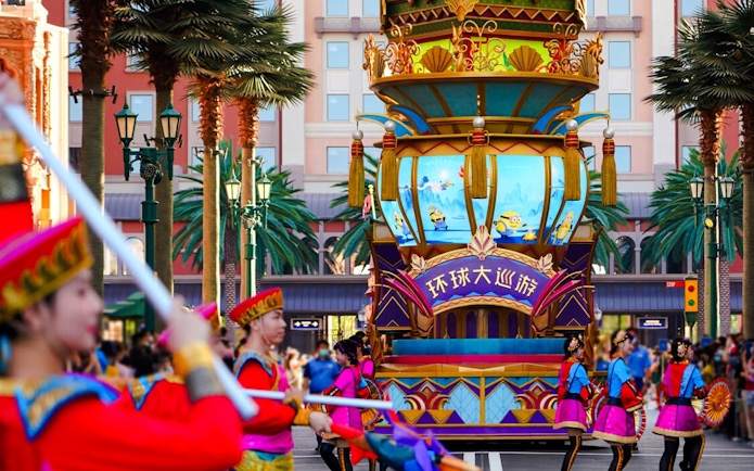 Parade with performers and Minions float at Universal Studios Beijing.