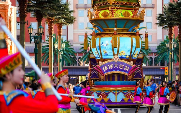 Parade with performers and Minions float at Universal Studios Beijing.