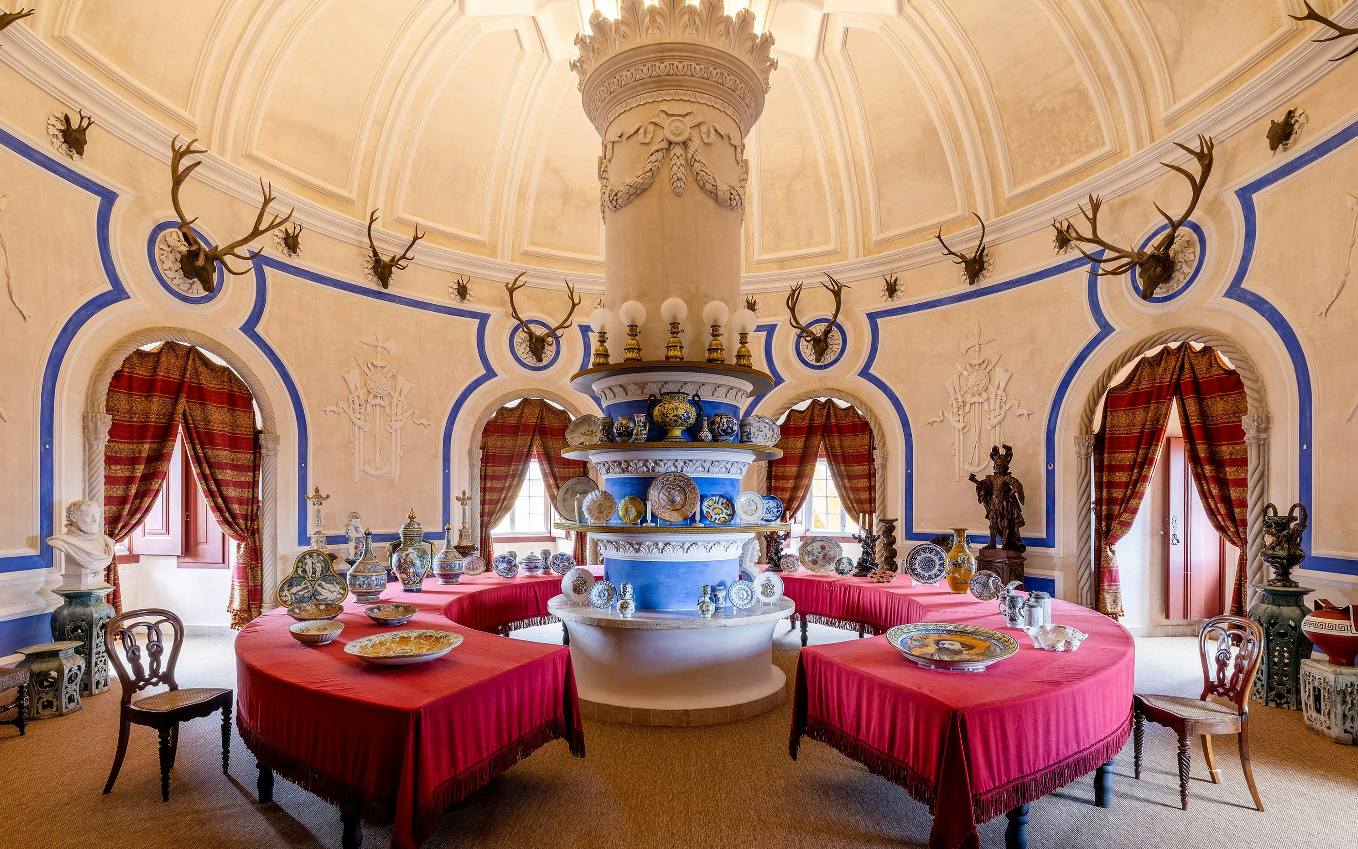 Stag Room in Pena Palace featuring antler decor and ornate ceramics, Sintra, Lisbon.