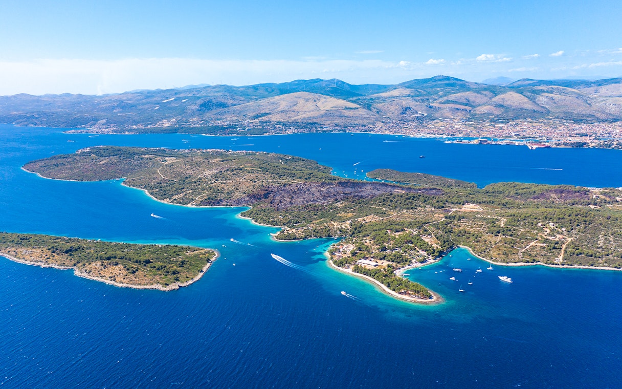 Aerial view of islands near Split, Croatia, featuring boats in the Blue Lagoon.