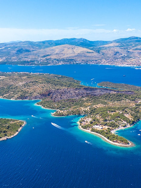 Aerial view of islands near Split, Croatia, featuring boats in the Blue Lagoon.