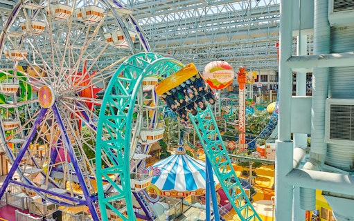 Guests on a roller coaster at Nickelodeon Universe, Mall of America.