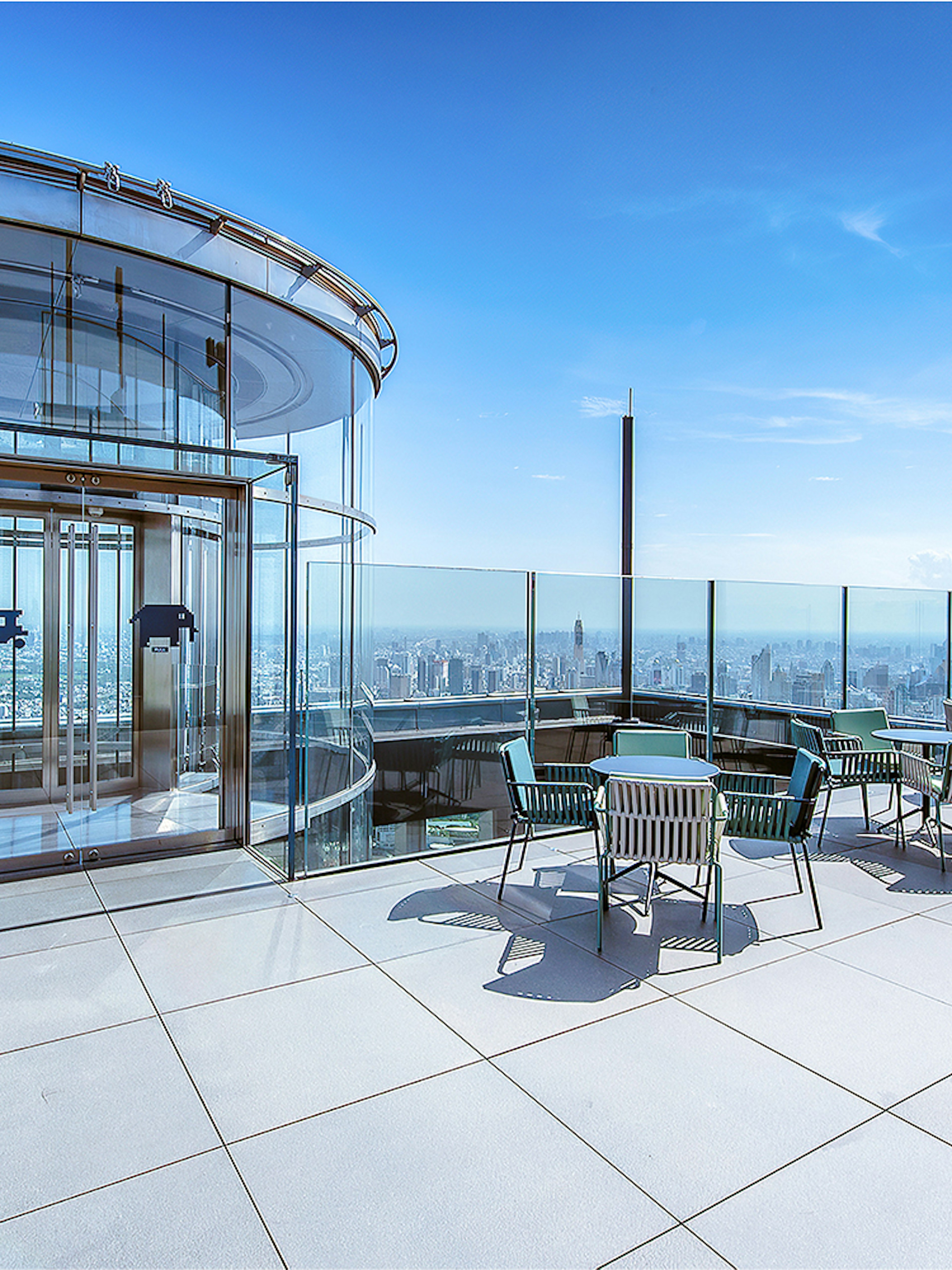 Mahanakhon SkyWalk glass elevator and observation deck with city view in Bangkok, Thailand.