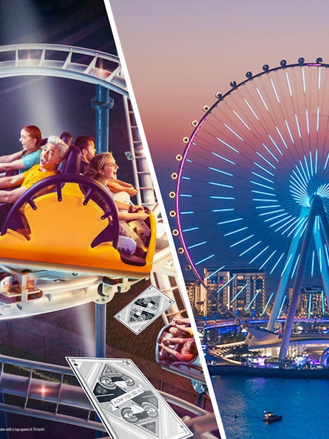 Ain Dubai illuminated at night with a roller coaster ride in the foreground.