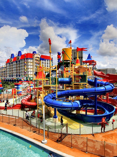 Colorful water park with slides and pools at Legoland Malaysia Resort.