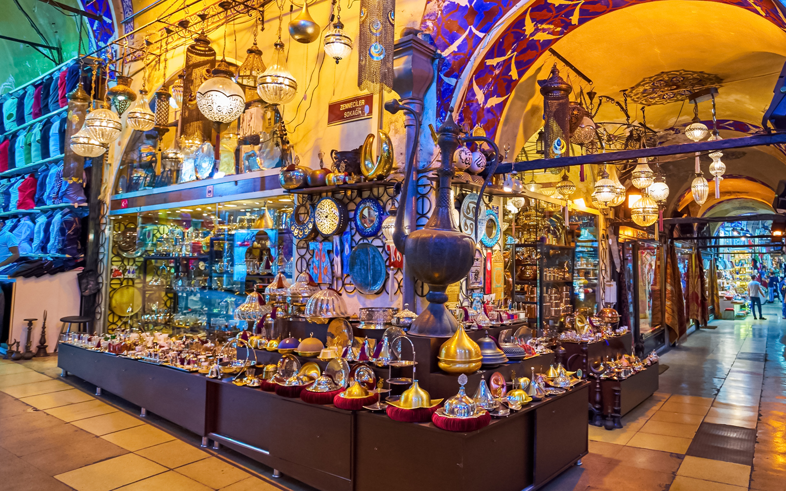 Grand Bazaar Istanbul Turkey with vibrant market stalls and shoppers exploring traditional goods.