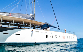 Catamaran sailing on clear waters during sunset tour in Cartagena.