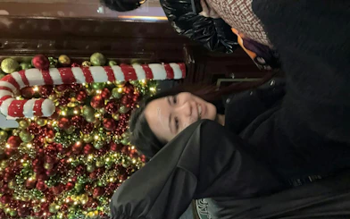 Glasgow Ghost Hunt participant near festive decorations in Glasgow.