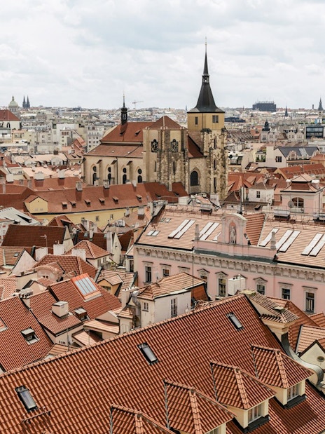 View of Prague's red rooftops and historic buildings from the Astronomical Tower of Clementinum.
