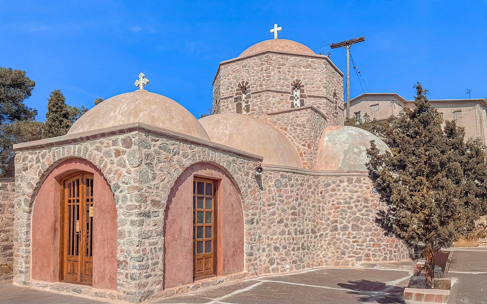 Monastery of Prophet Elias in Santorini with stone architecture and domes.