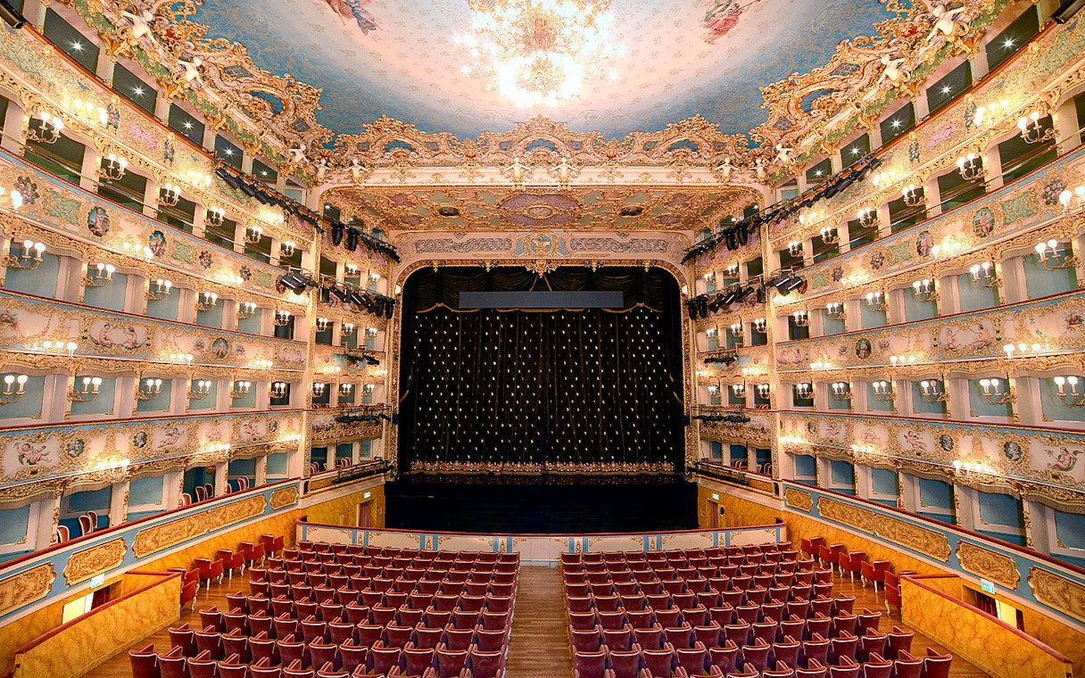 Fenice Theater interior with ornate balconies and stage, Venice.