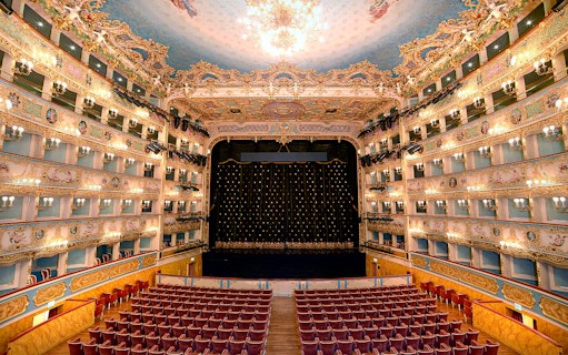 Fenice Theater interior with ornate balconies and stage, Venice.