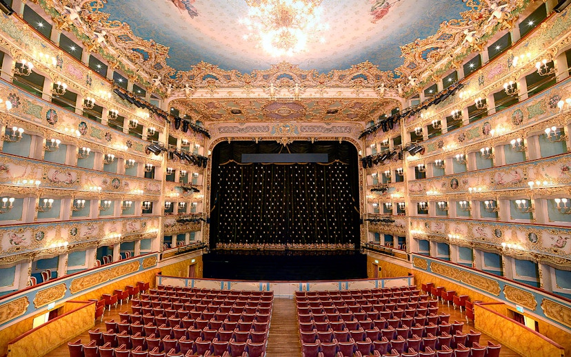 Fenice Theater interior with ornate balconies and stage, Venice.