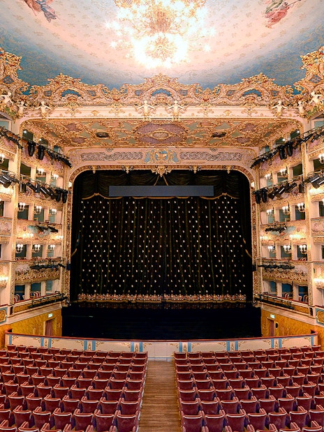 Fenice Theater interior with ornate balconies and stage, Venice.