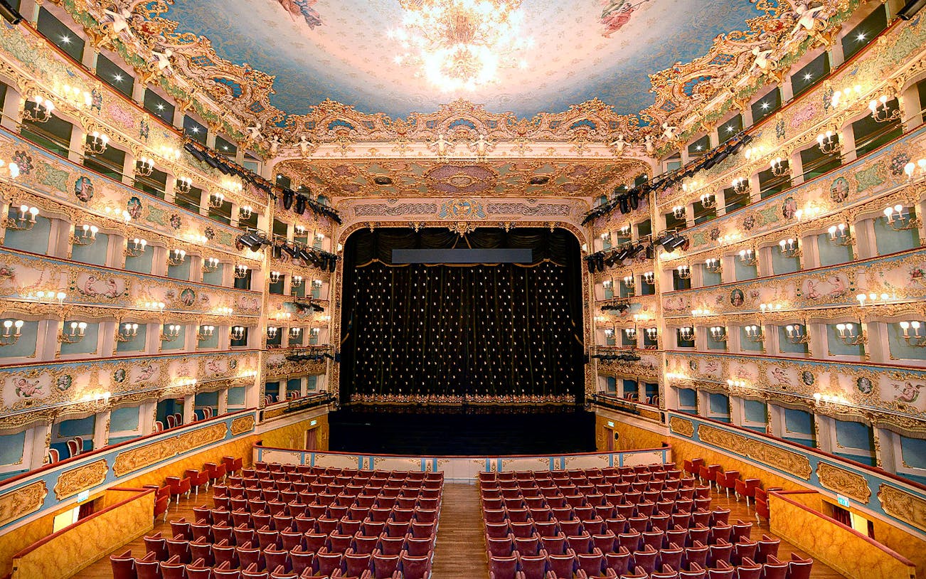 Fenice Theater interior with ornate balconies and stage, Venice.