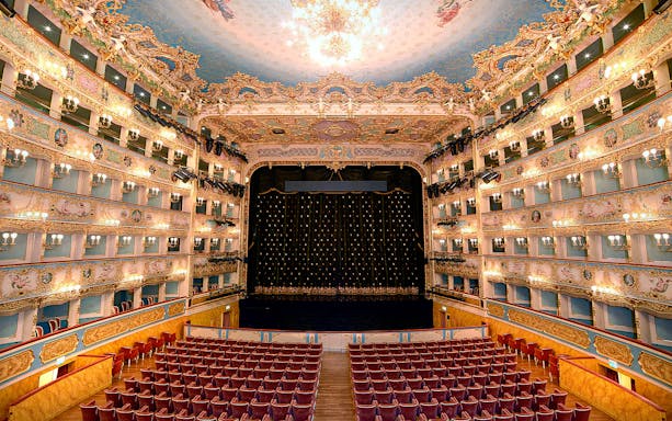 Fenice Theater interior with ornate balconies and stage, Venice.